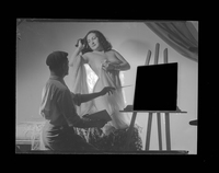 [Diana Russell: Escena de pintor, modelo y lienzo]