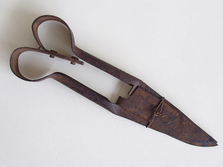 Tijerón de metal para esquilar